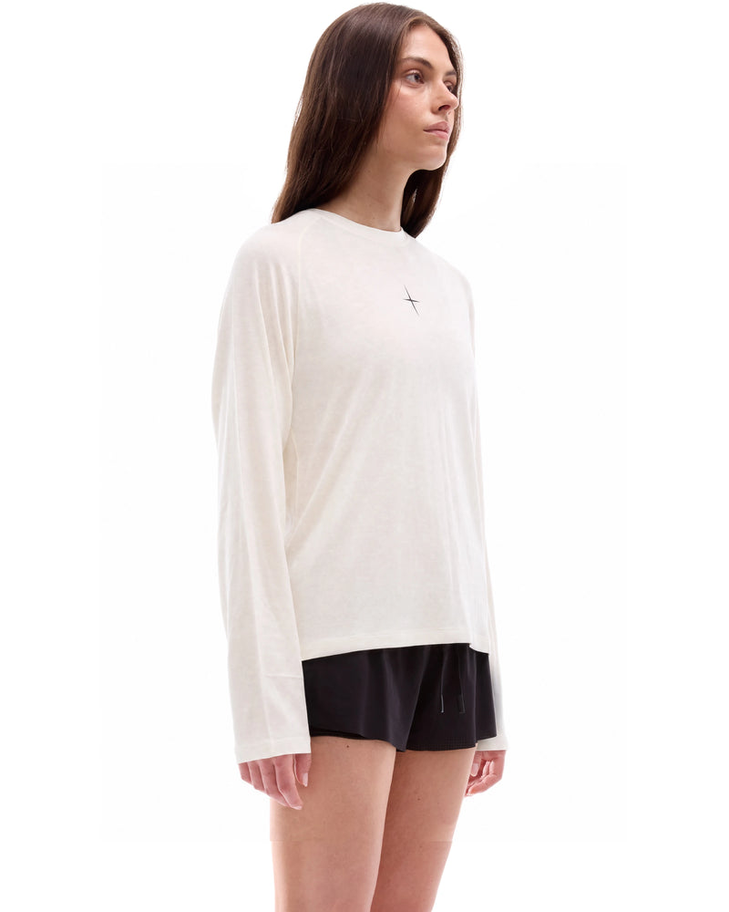 INNER SELF Lightweight Merino Running LS in off-white — three-quarter view on female model