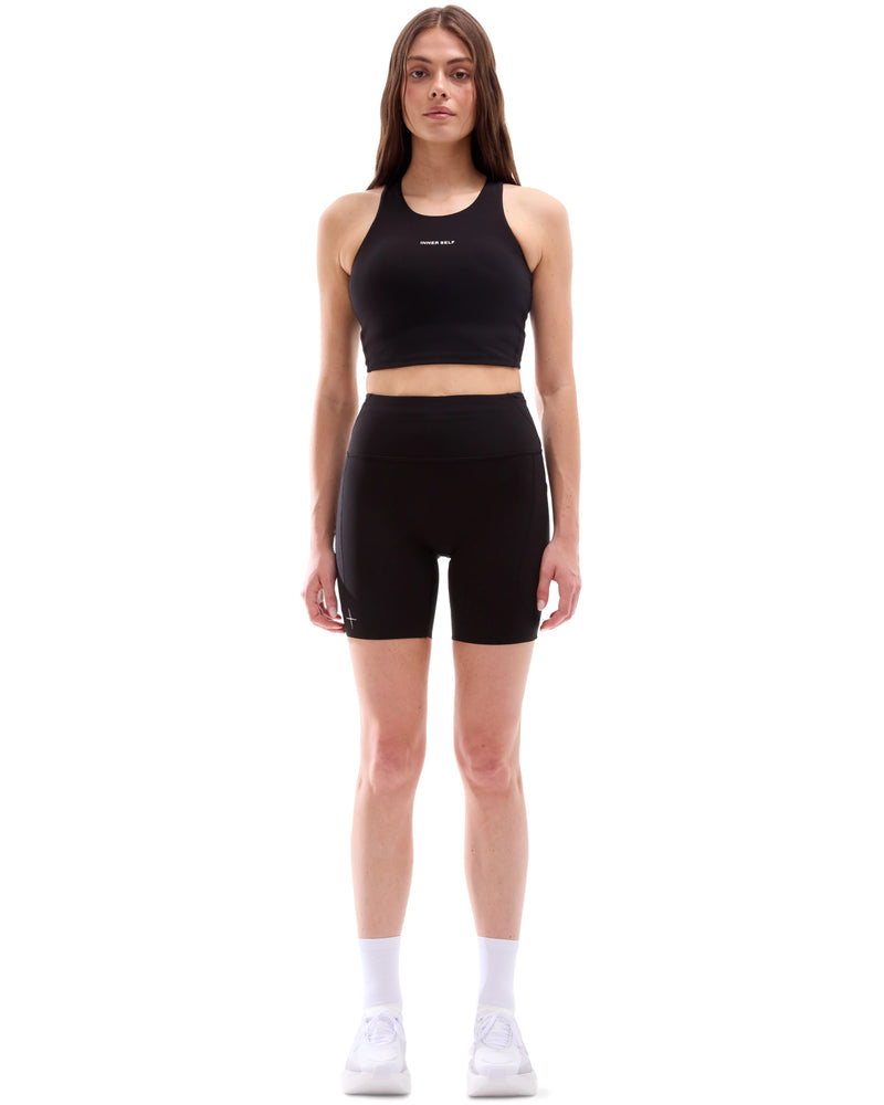 INNER SELF Women's 6.5" Half Tights High Rise W/ Pockets in black — full-length view on female model