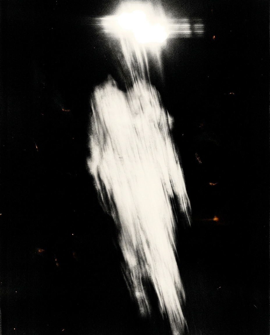 A running figure dissolved into a vertical cream smear against dense black