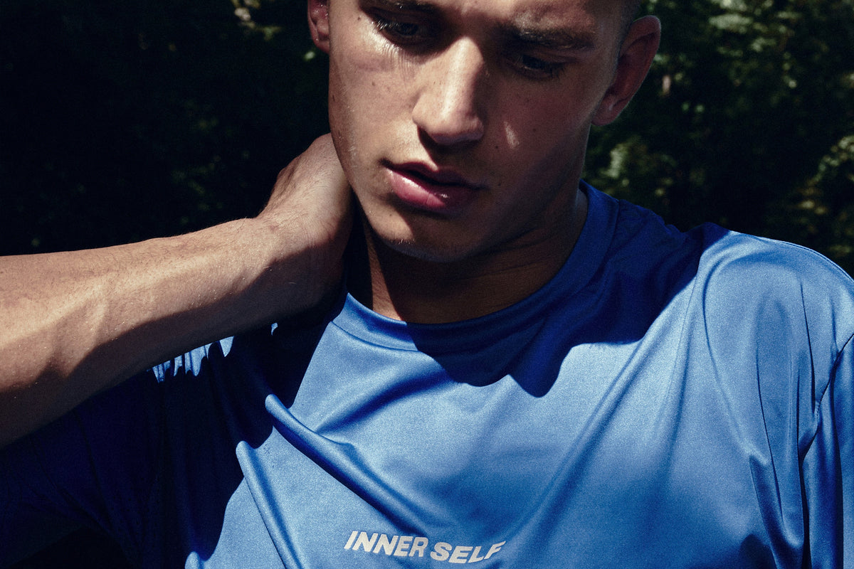 Portrait of a model wearing a blue T-shirt