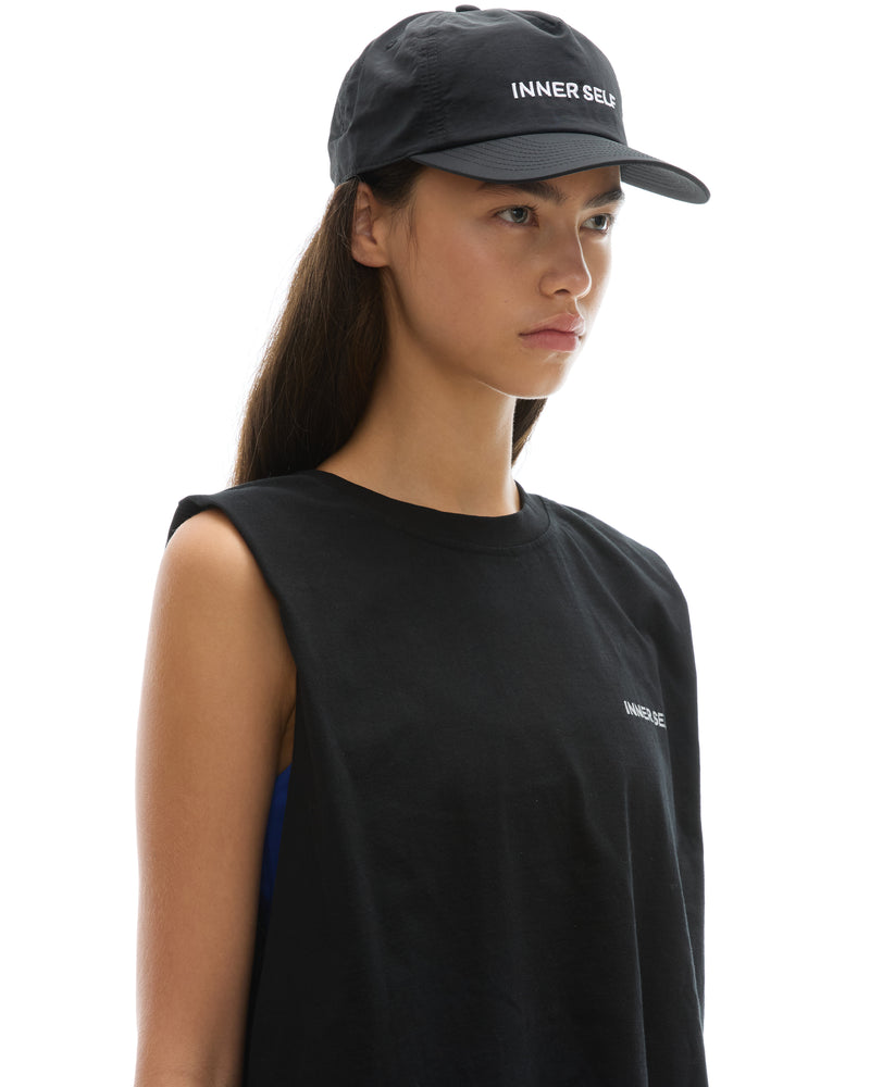 INNER SELF Daily Cap in black — three-quarter view on female model