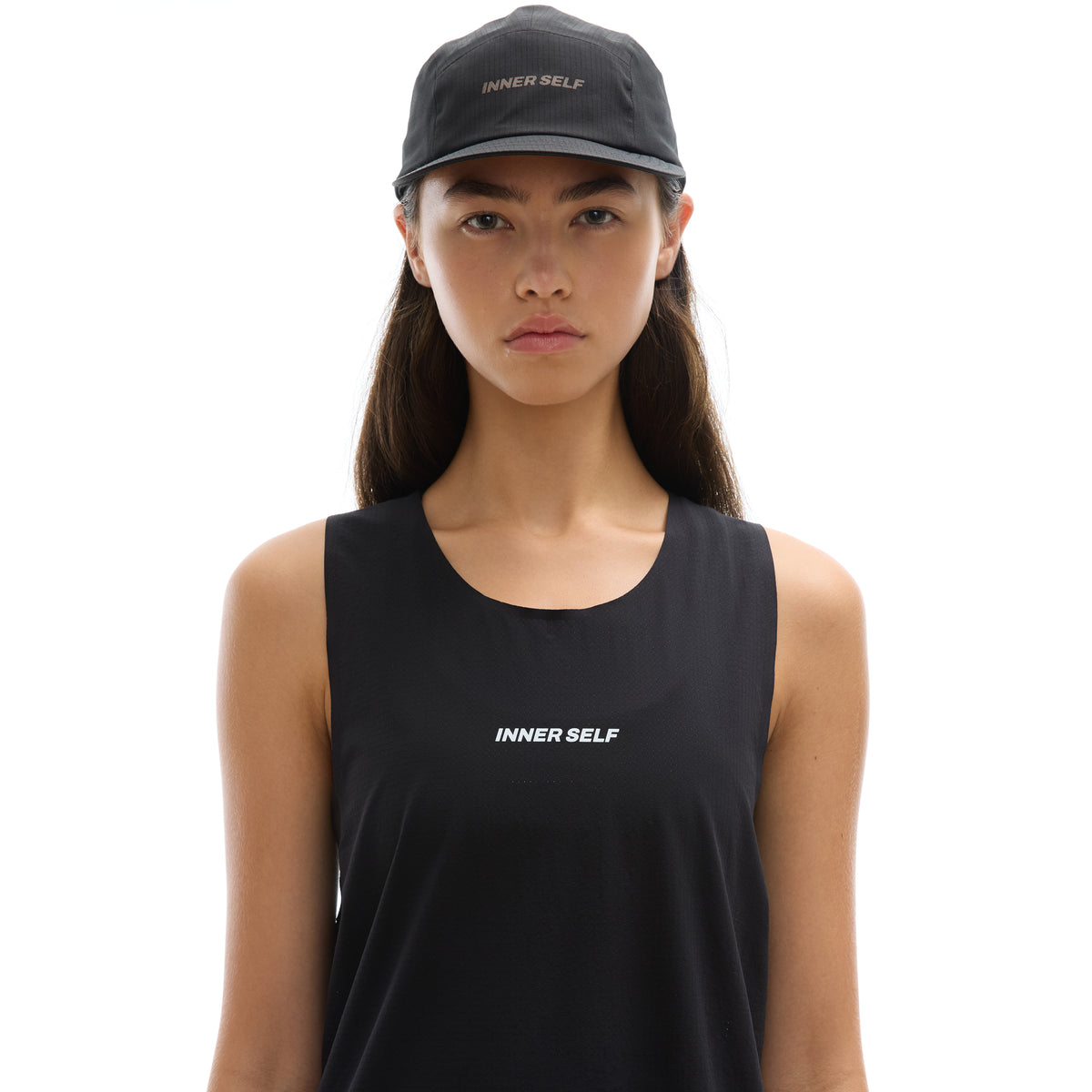 INNER SELF Performance Cap in black — front view on female model