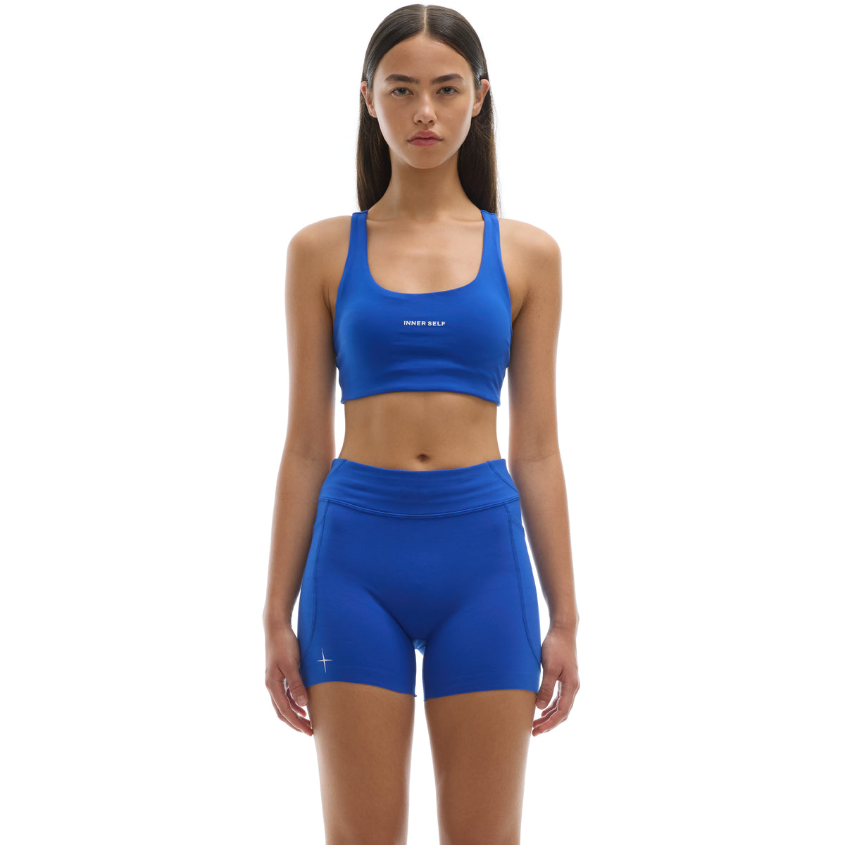 INNER SELF Women's Running Bra in blue — front view on female model