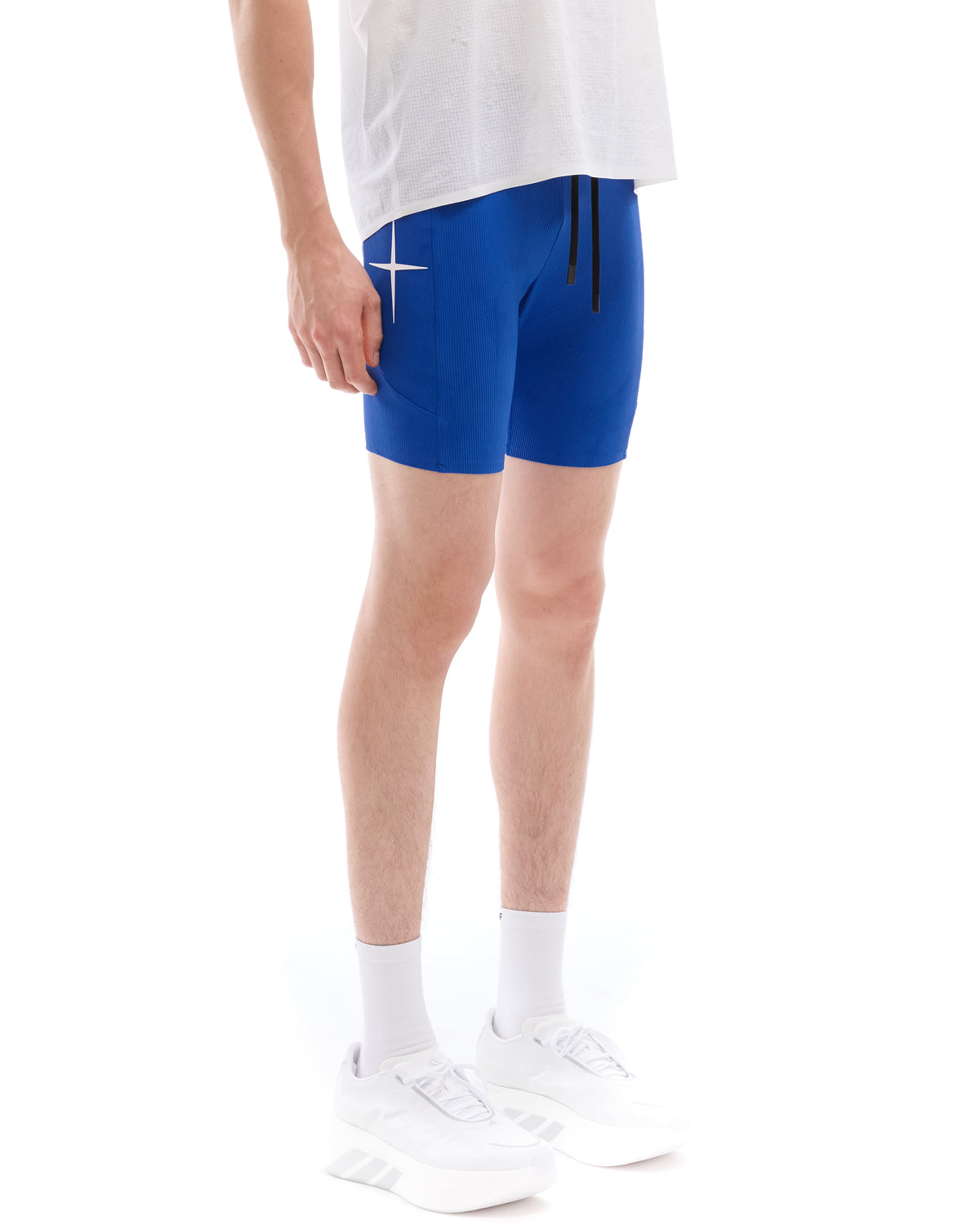 INNER SELF Men's Half Tights W/ Pockets in blue — three-quarter view on male model