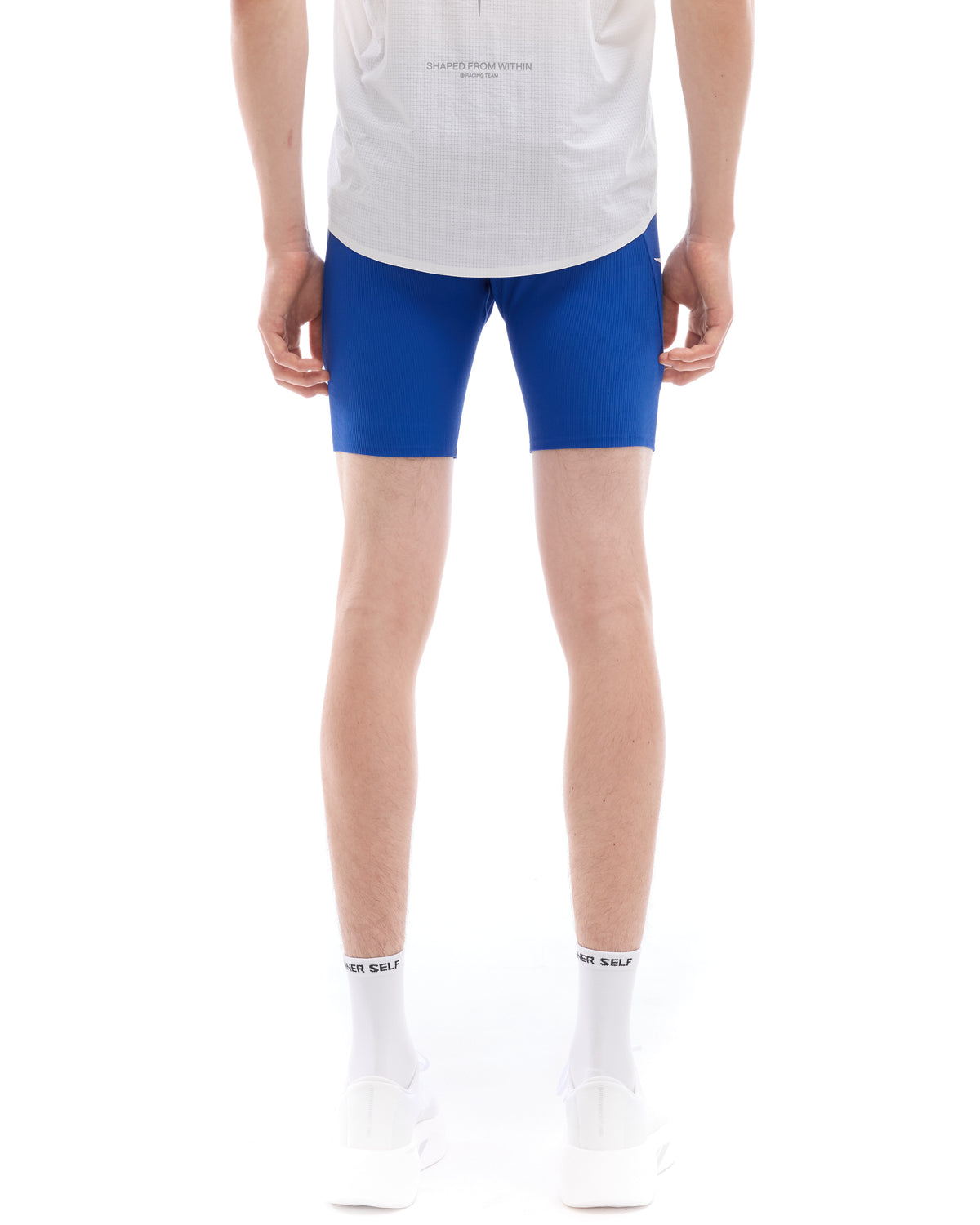 INNER SELF Men's Half Tights W/ Pockets in blue — back view on male model