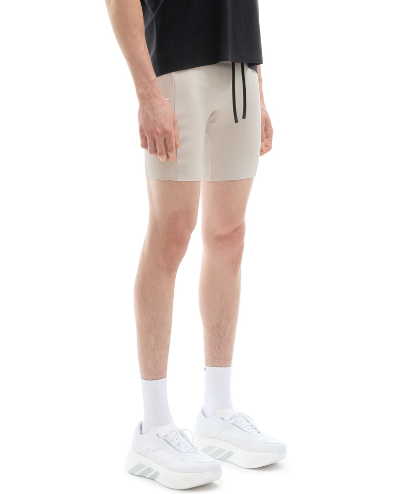 INNER SELF Men's Half Tights W/ Pockets in gray — three-quarter view on male model