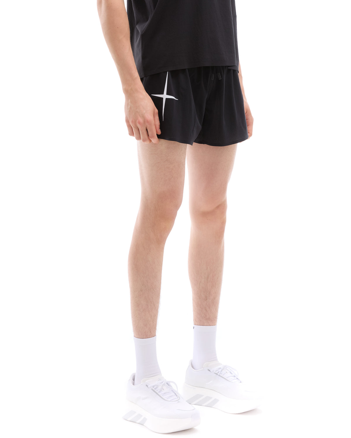 INNER SELF Men's Race Shorts in black — three-quarter view on male model
