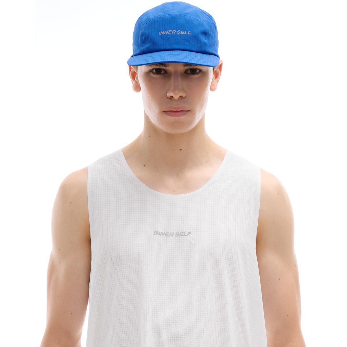 INNER SELF Performance Cap in blue — front view on male model