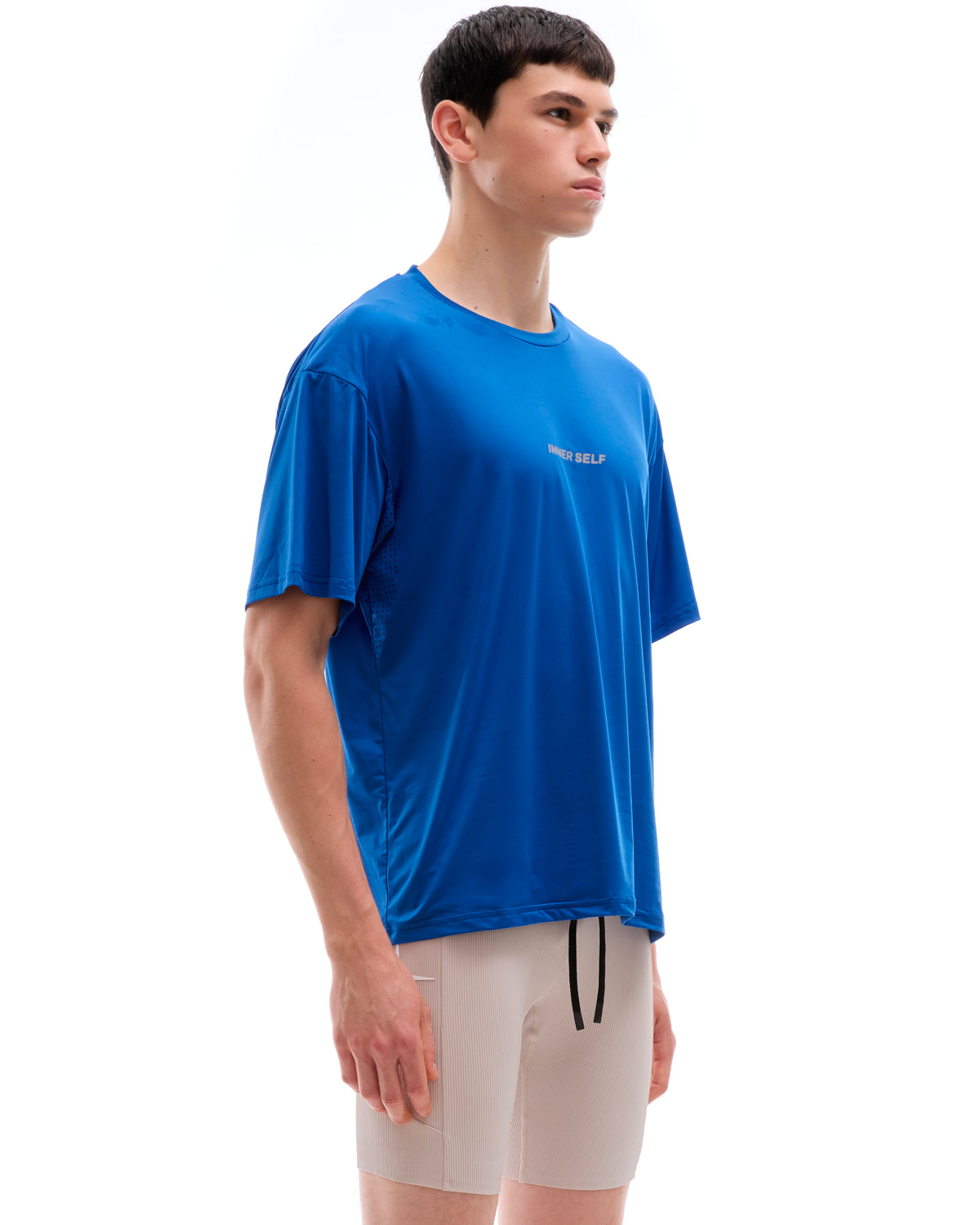 INNER SELF Performance T-shirt in blue — three-quarter view on male model