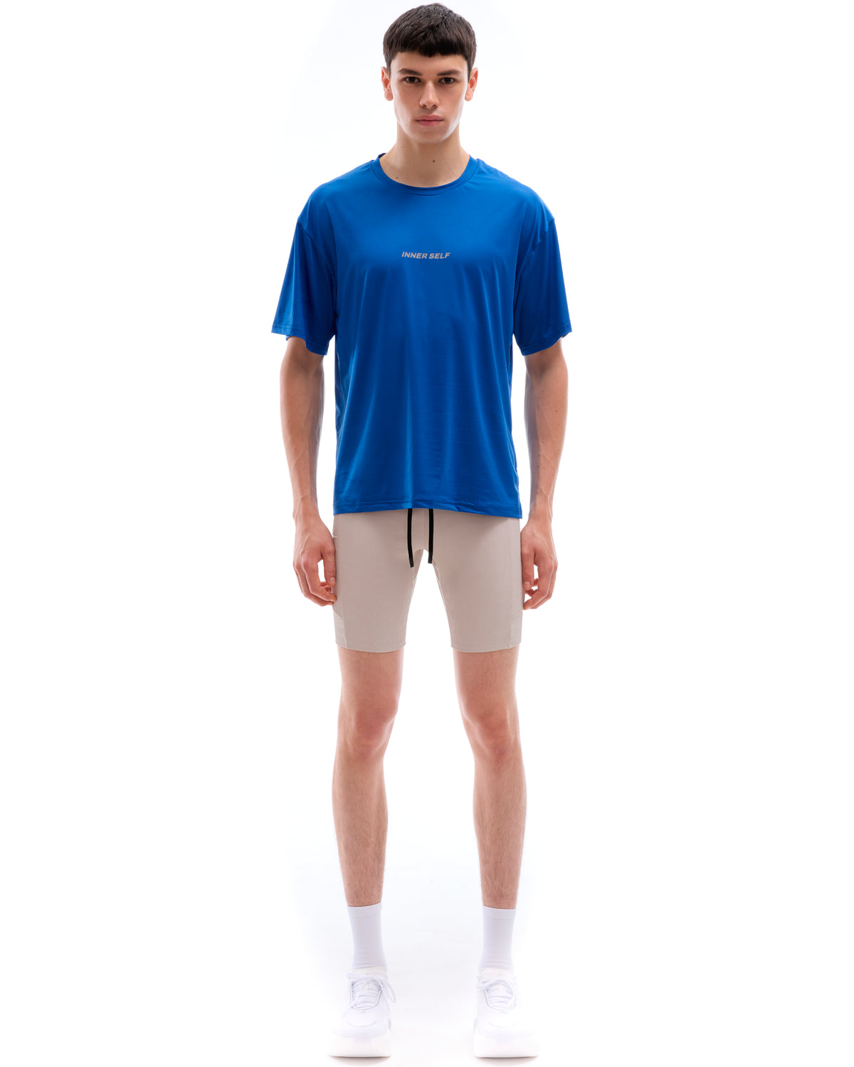 INNER SELF Performance T-shirt in blue — full-length view on male model