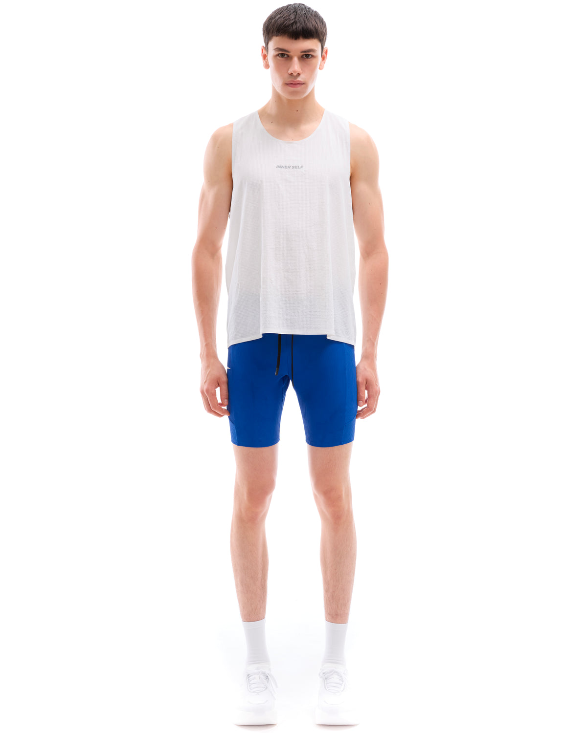 INNER SELF Performance Singlet in white — full-length view on male model