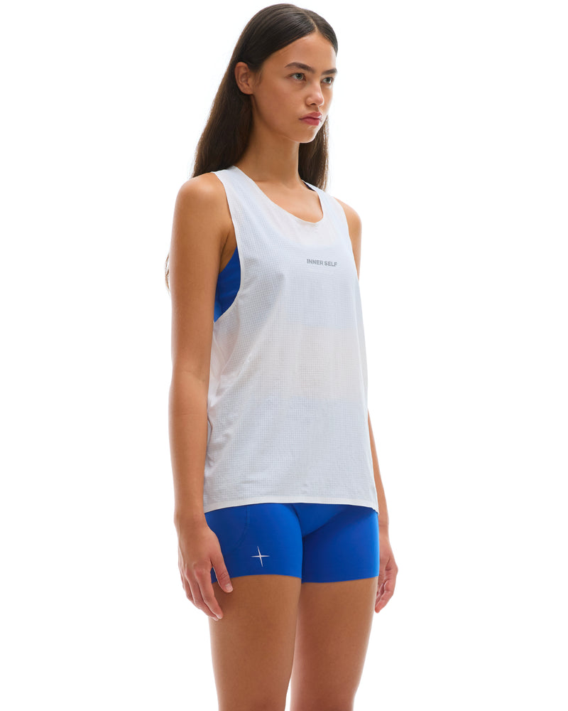 INNER SELF Performance Singlet in white — three-quarter view on female model