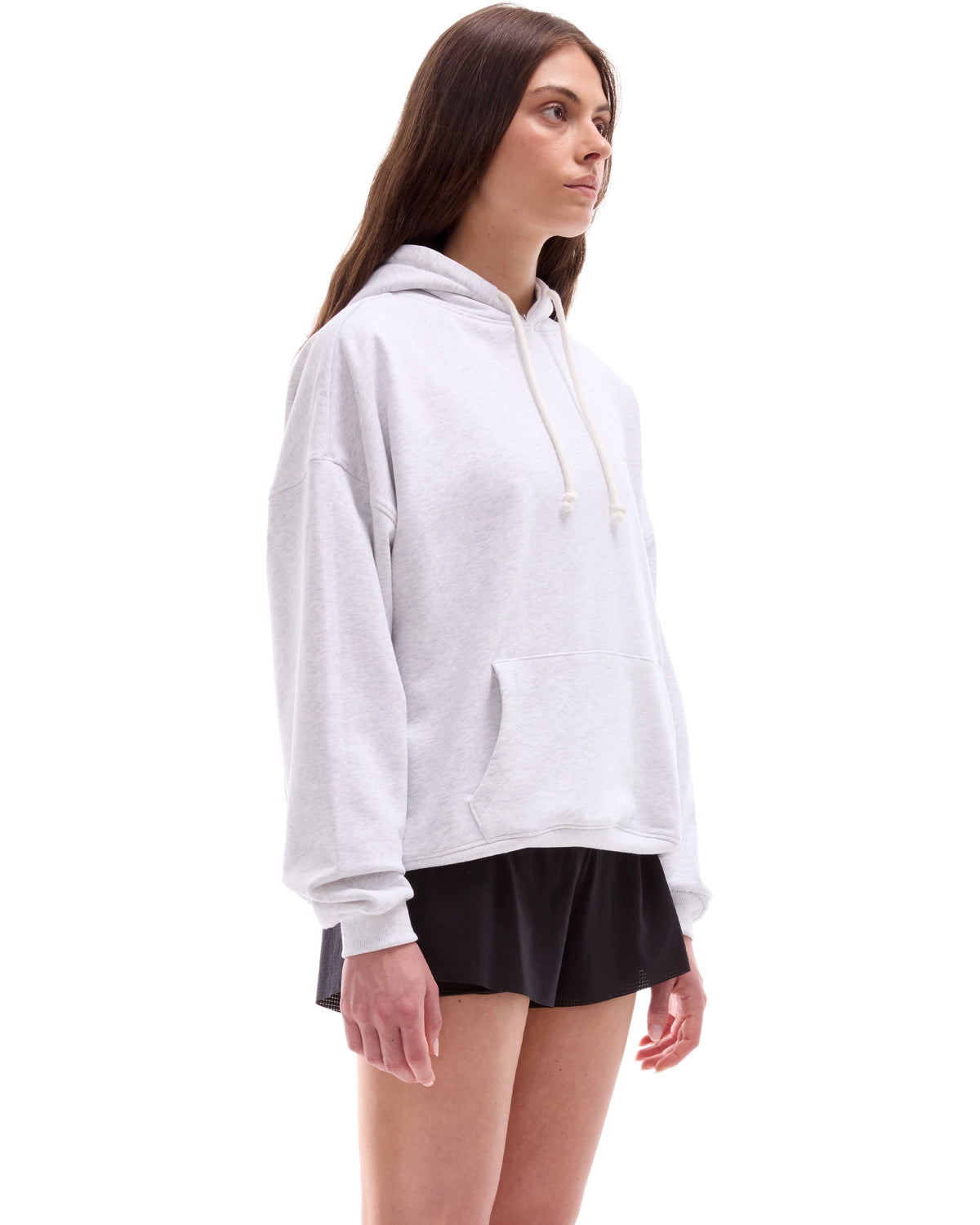 INNER SELF Core Hoodie in grey — three-quarter view on female model