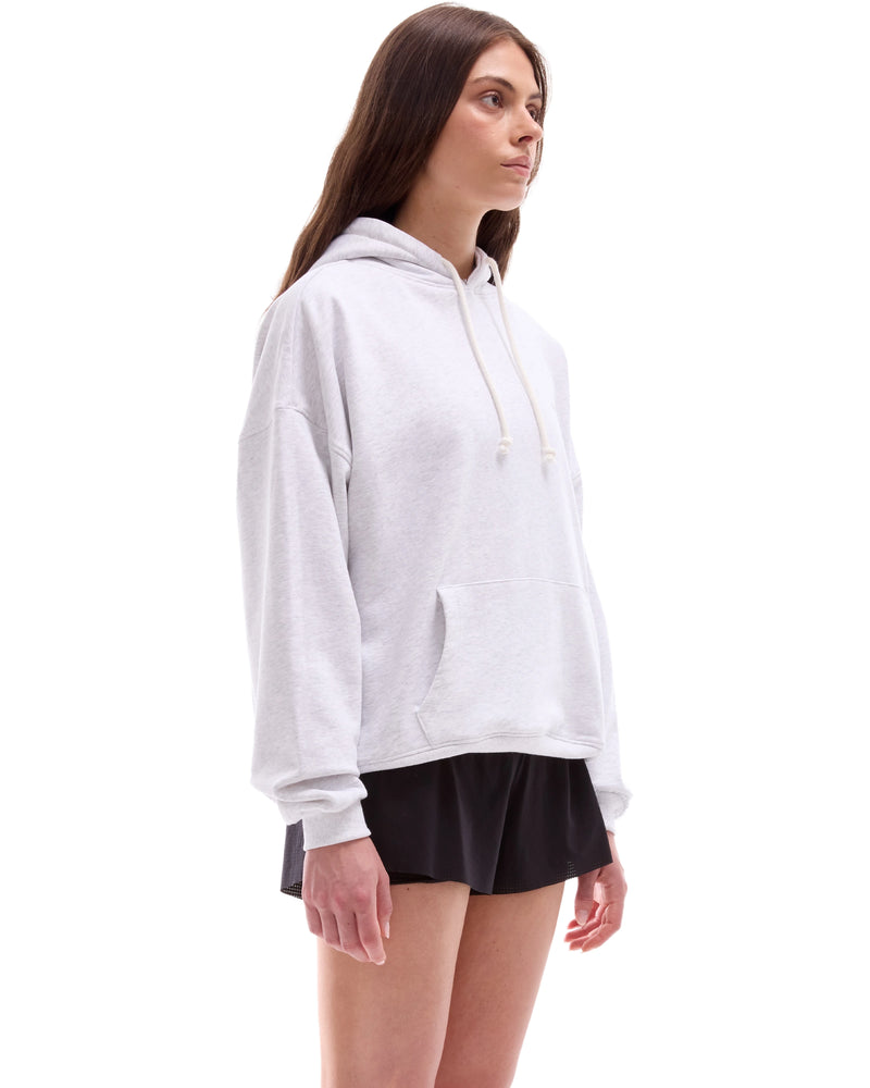 INNER SELF Core Hoodie in grey — three-quarter view on female model
