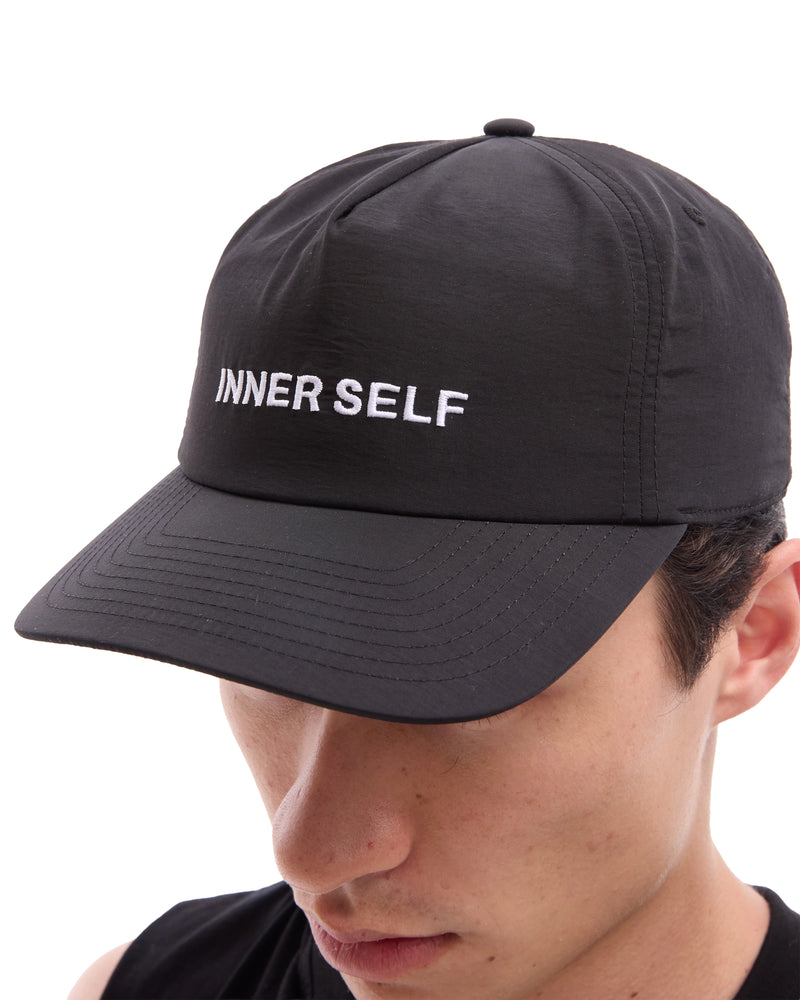 INNER SELF Daily Cap in black — close-up detail