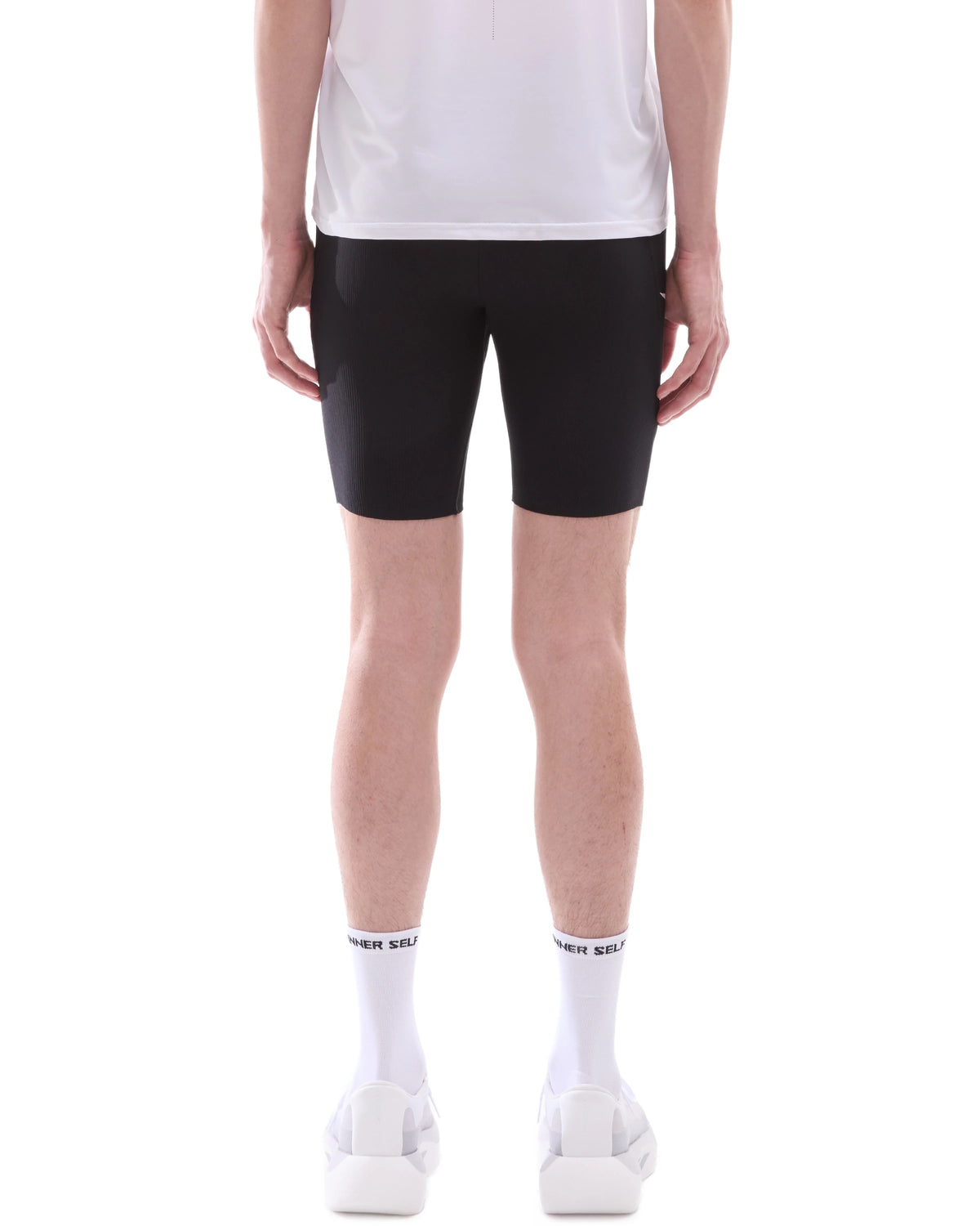 INNER SELF Men's Half Tights W/ Pockets in black — back view on male model