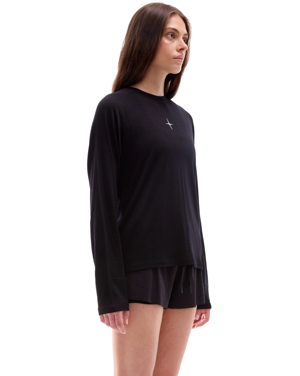 INNER SELF Lightweight Merino Running LS in black — three-quarter view on female model
