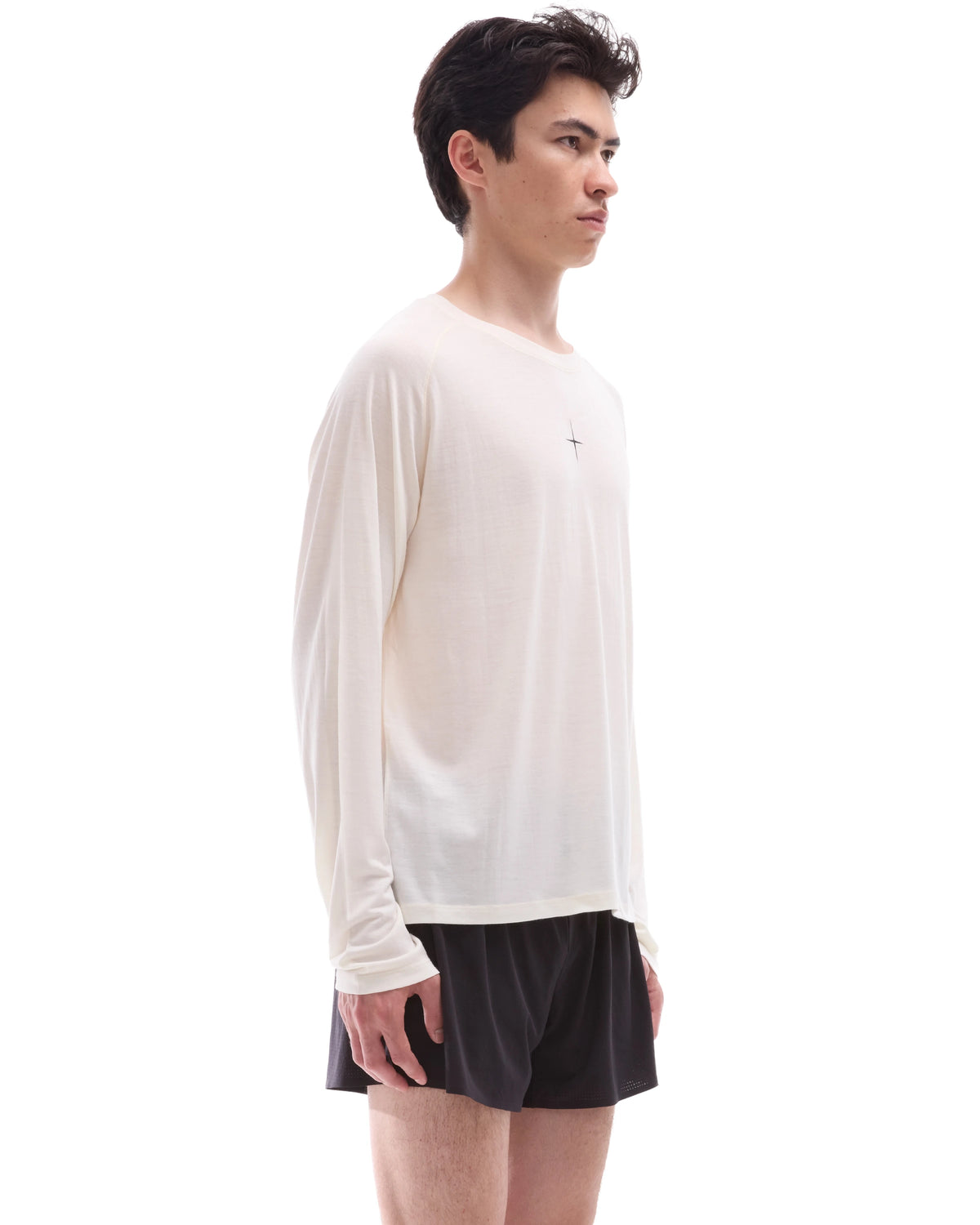 INNER SELF Lightweight Merino Running LS in off-white — three-quarter view on male model