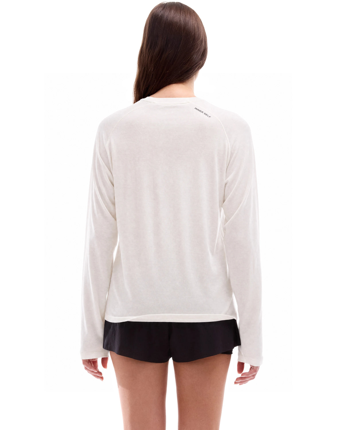 INNER SELF Lightweight Merino Running LS in off-white — back view on female model
