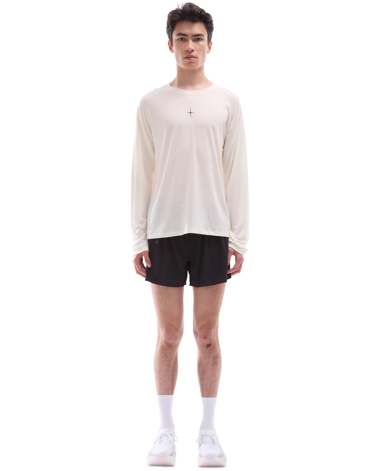 INNER SELF Lightweight Merino Running LS in off-white — full-length view on male model