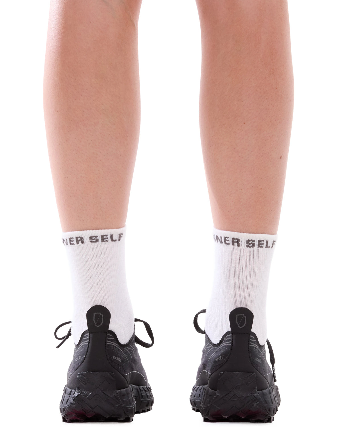 INNER SELF Merino Running Socks in white — back view on male model