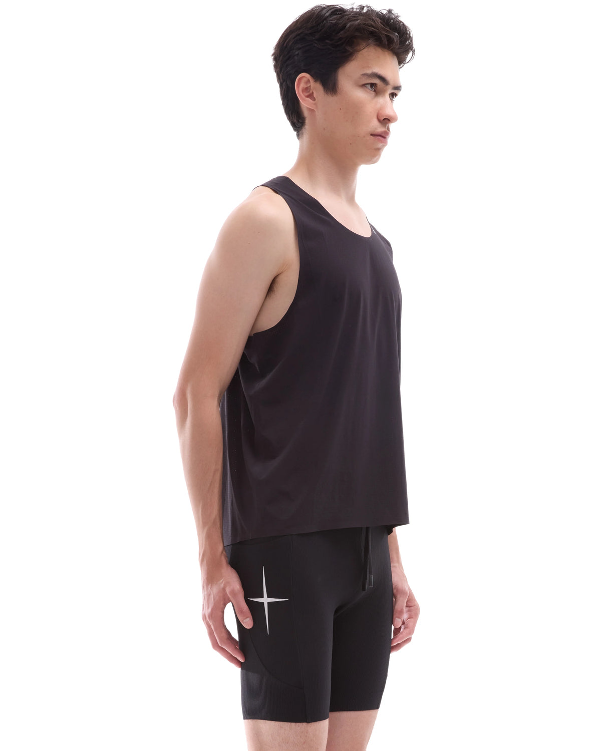 INNER SELF Performance Singlet in black — three-quarter view on male model