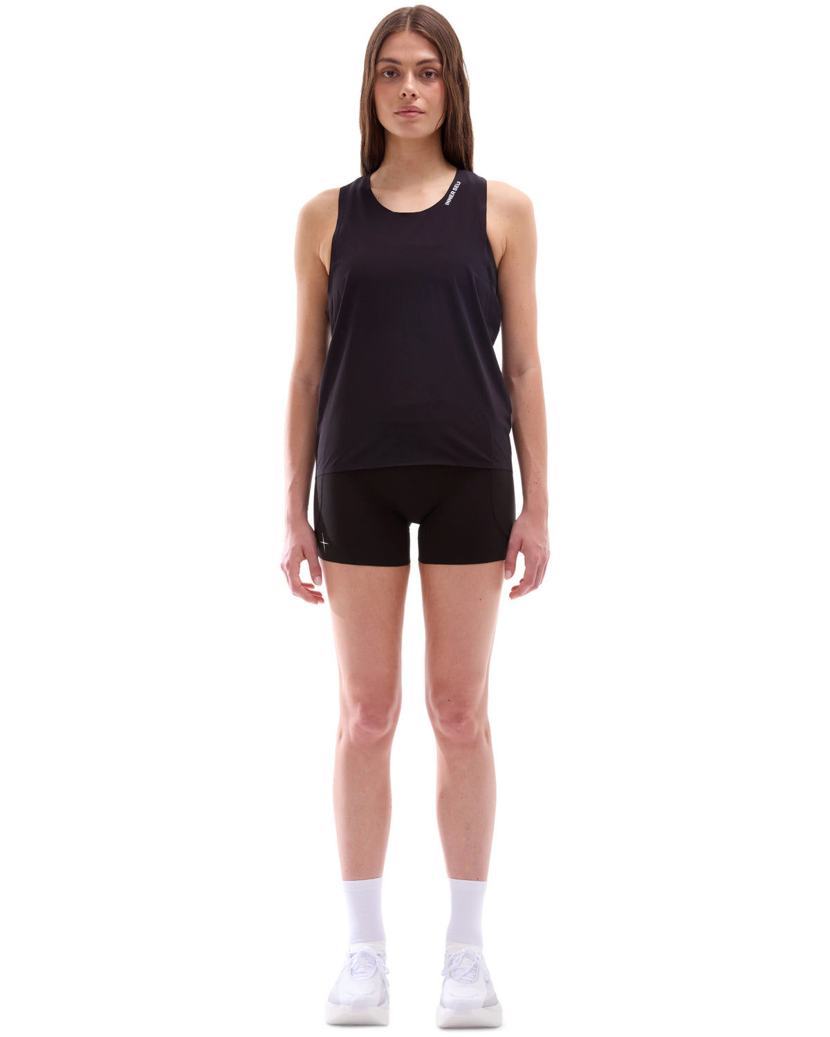 INNER SELF Performance Singlet in black — full-length view on female model