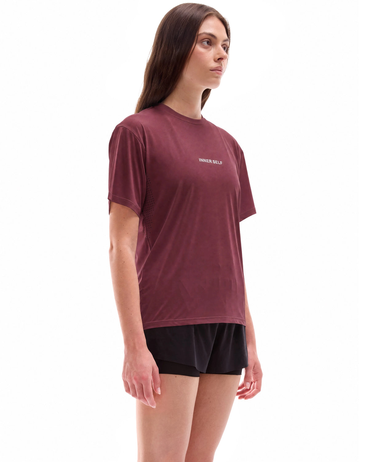 INNER SELF Performance T-shirt in red — three-quarter view on female model
