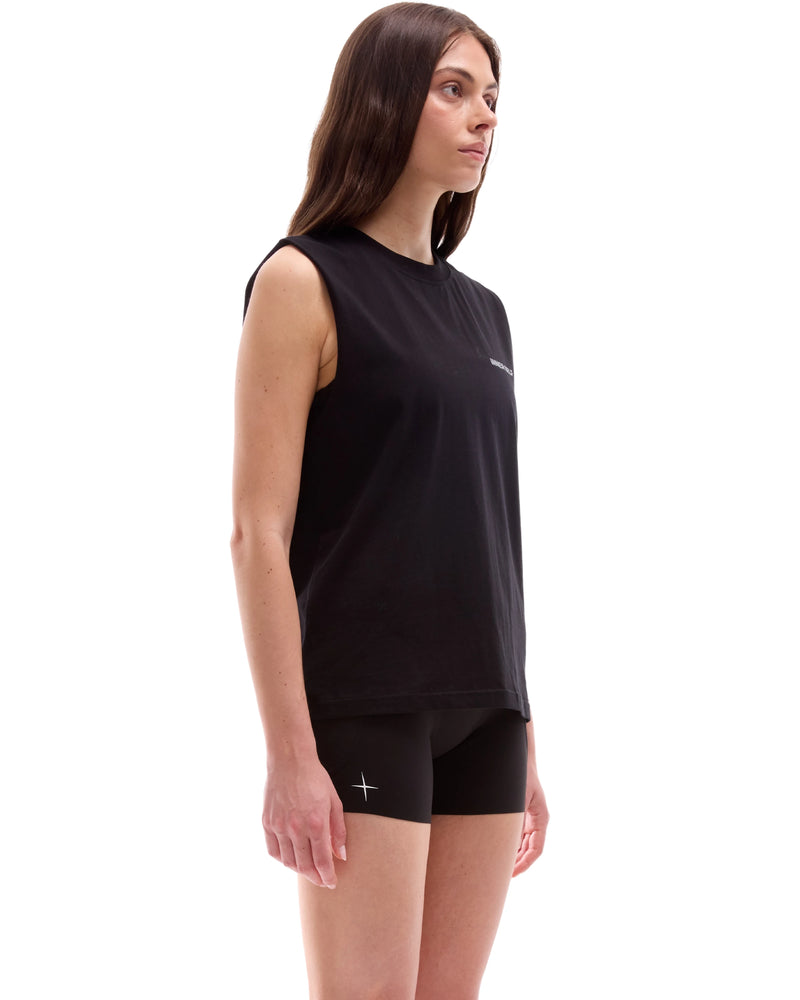 INNER SELF Running Tank in washed black — three-quarter view on female model