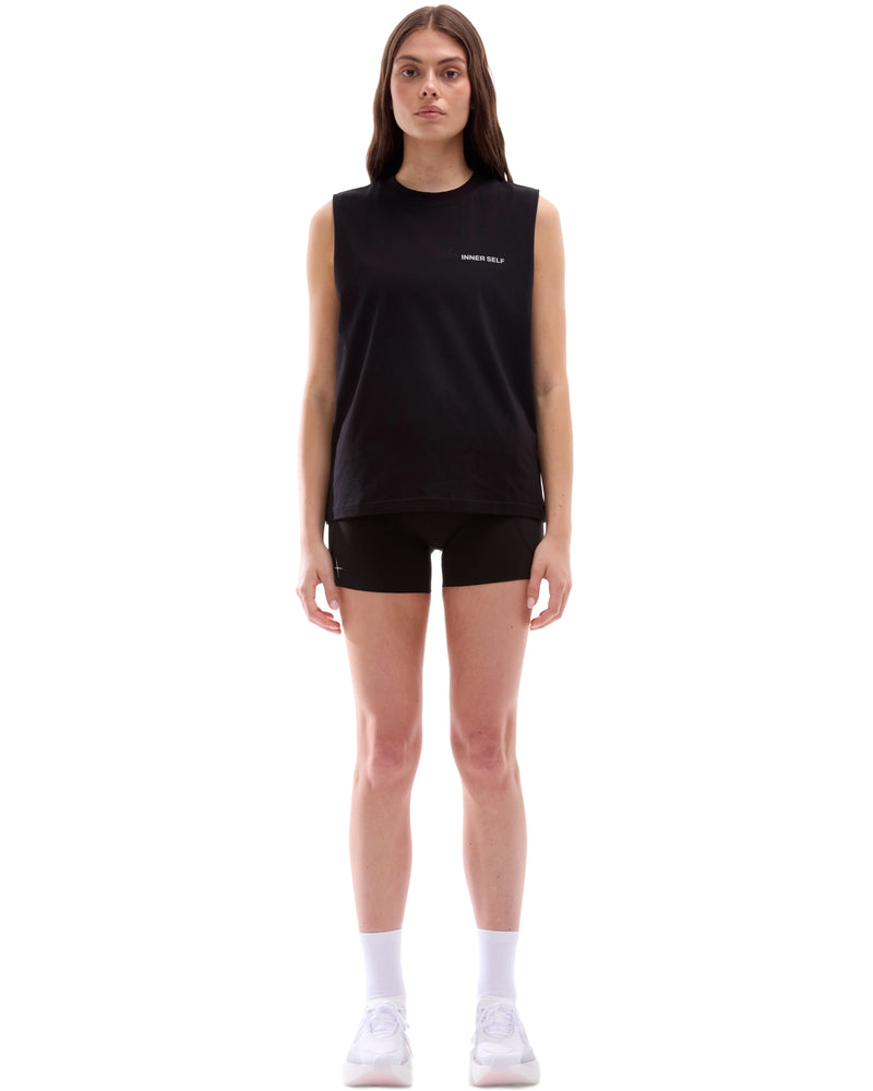 INNER SELF Running Tank in washed black — full-length view on female model