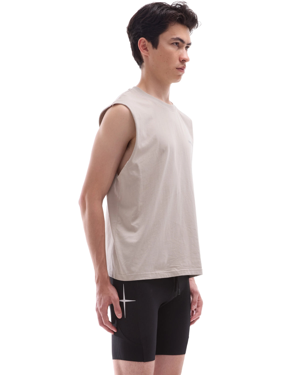 INNER SELF Running Tank in washed grey — three-quarter view on male model