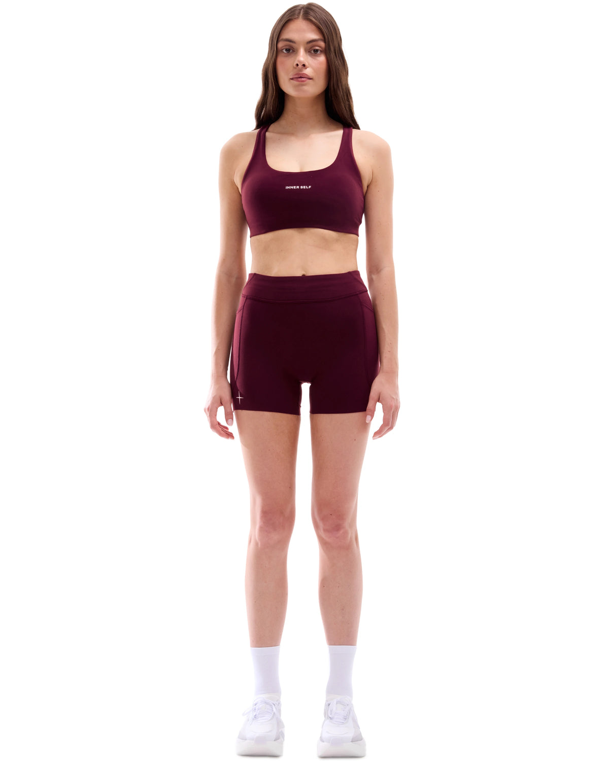 INNER SELF Women's 4'' Half Tights W/ Pockets in red — full-length view on female model