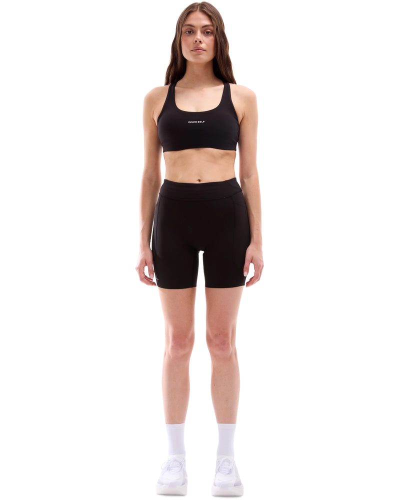 INNER SELF Women's 6.5'' Half Tights W/ Pockets in black — full-length view on female model